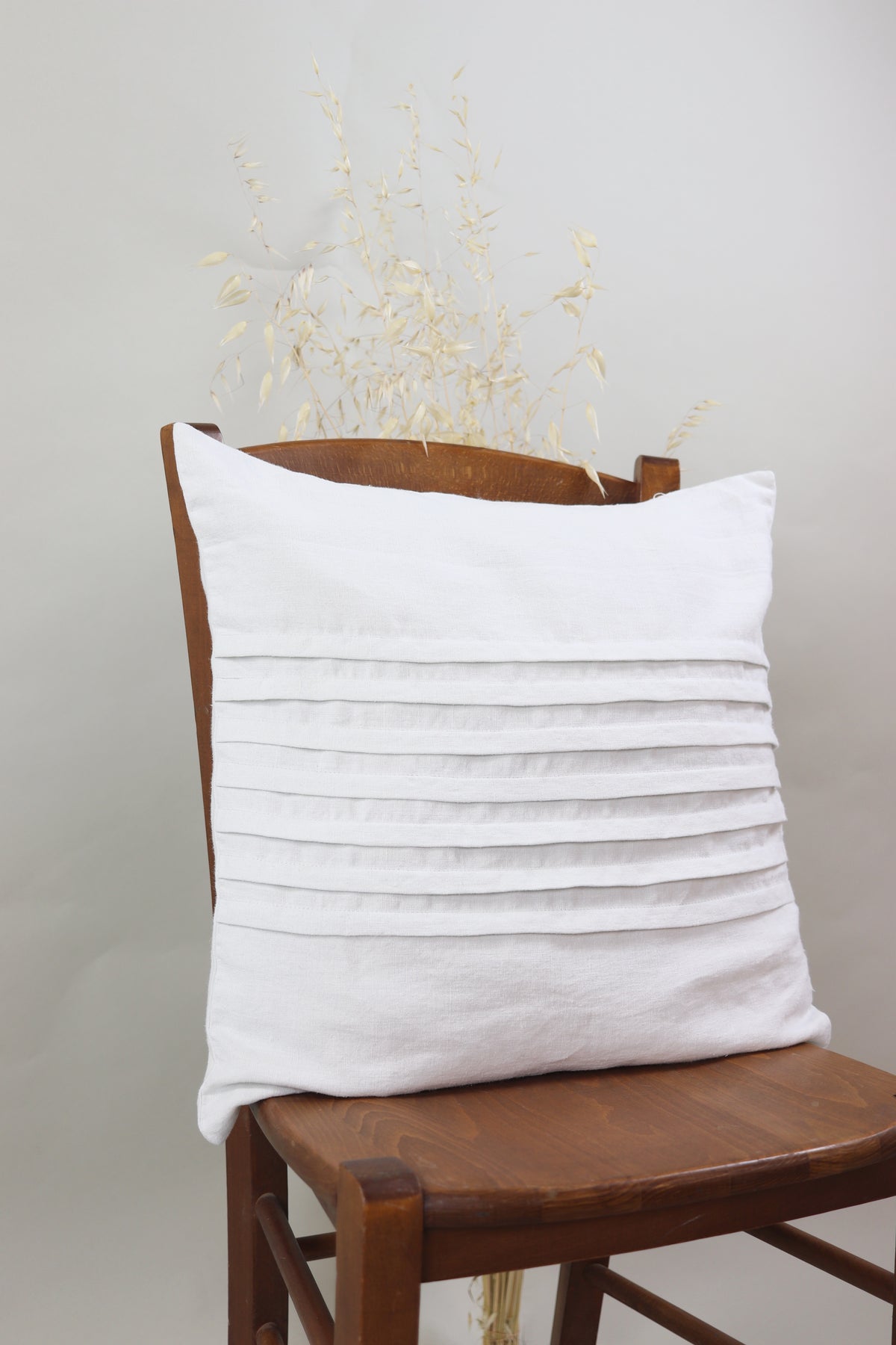 Cushion with pleats