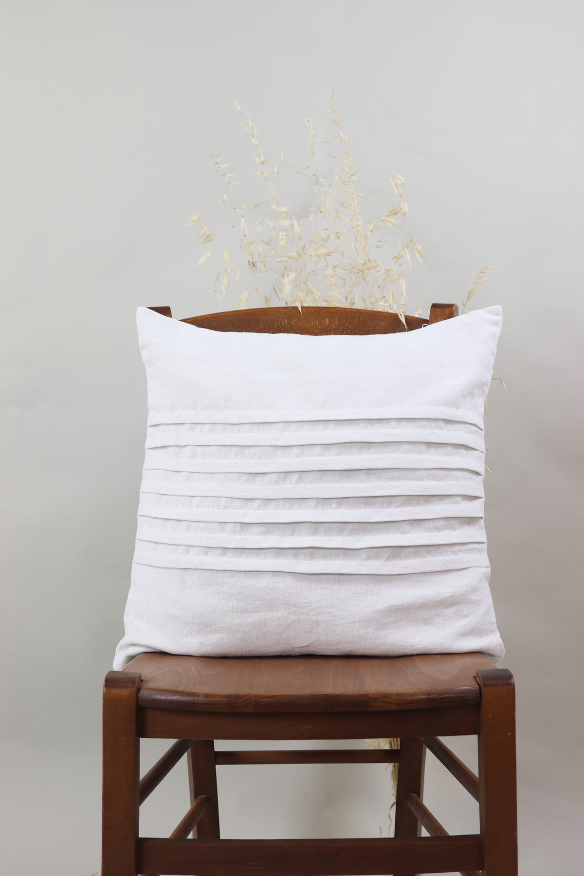 Cushion with pleats