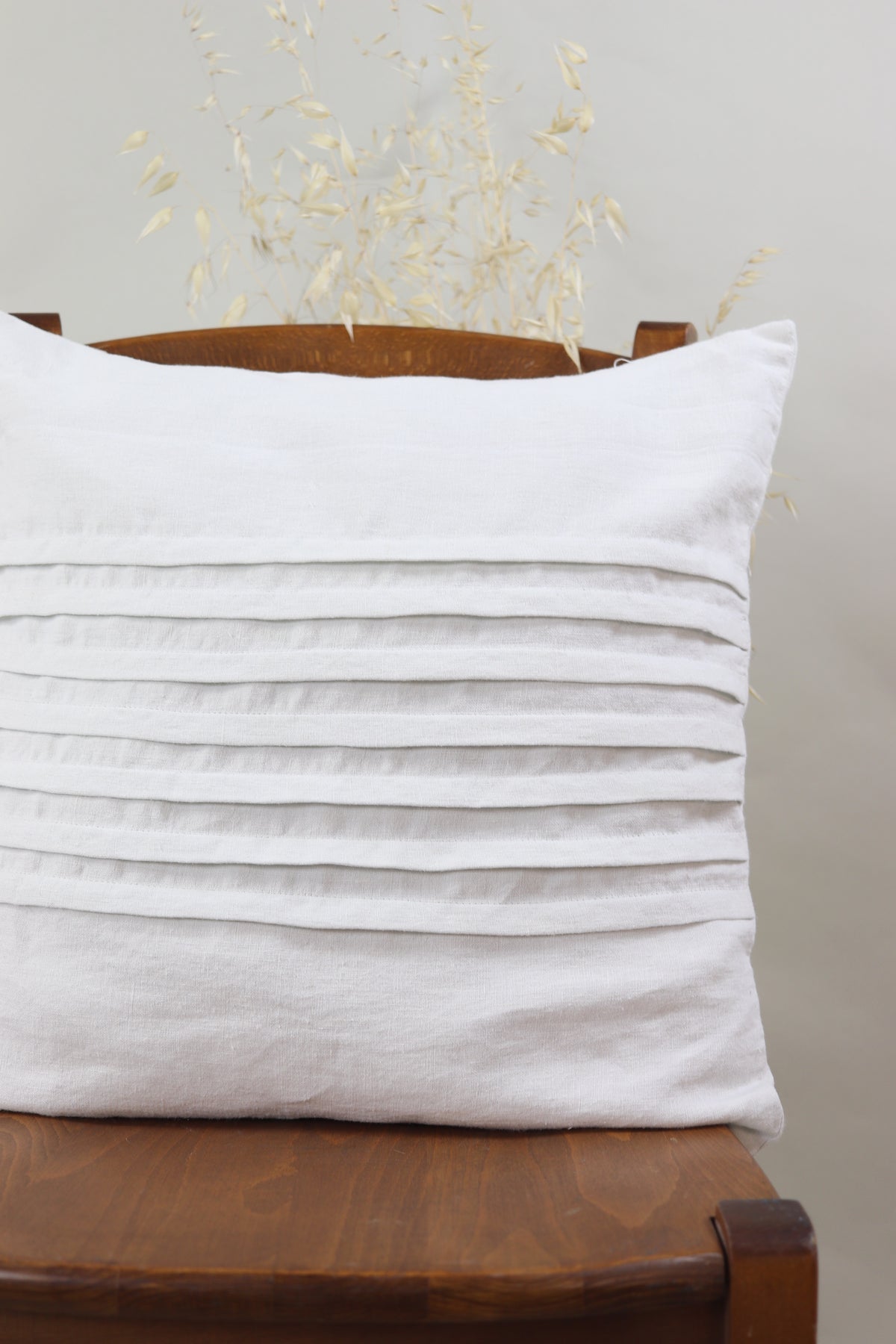Cushion with pleats